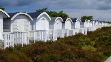 These are the rows of beach cabanas found in Ljunghusen, at the very southern tip of Sweden. Great weather, wonderful people, and just 30 minutes from Malmo, Sweden and Copenhagen, Denmark. Water was a bit cold for this American, but our Swedish friends love it!