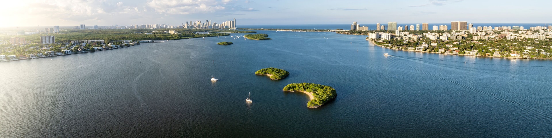 Aerial view of Biscayne Bay with skyline and small islands, Bay Harbor Islands, Florida, United States.