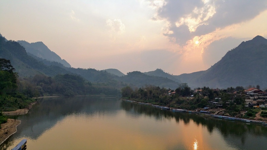 Nong Khiaw, Nam Ou River, Laos
This breathtaking little town is shrouded in mountains and great spot for sunsets. There are lots of cool things to do and see here in Northern Laos. #packsandaplan 
Check our guide for Nong Khiaw http://packsandaplan.com/?p=299
Check out our other adventures and useful information  http://packsandaplan.com/