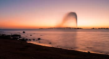 Panoramic view of the King Fahd's Fountain seen from the South Corniche, Jeddah, Saudi Arabia, with a beautiful sunset in the background
