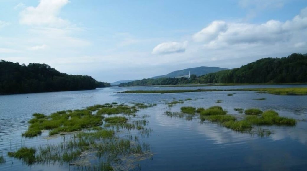 A beautiful walking trail along the inner section of the Mabou Inlet. Bald eagles are often spotted along this trail. This view looks back across the inlet towards the town of Mabou and its striking church spire.