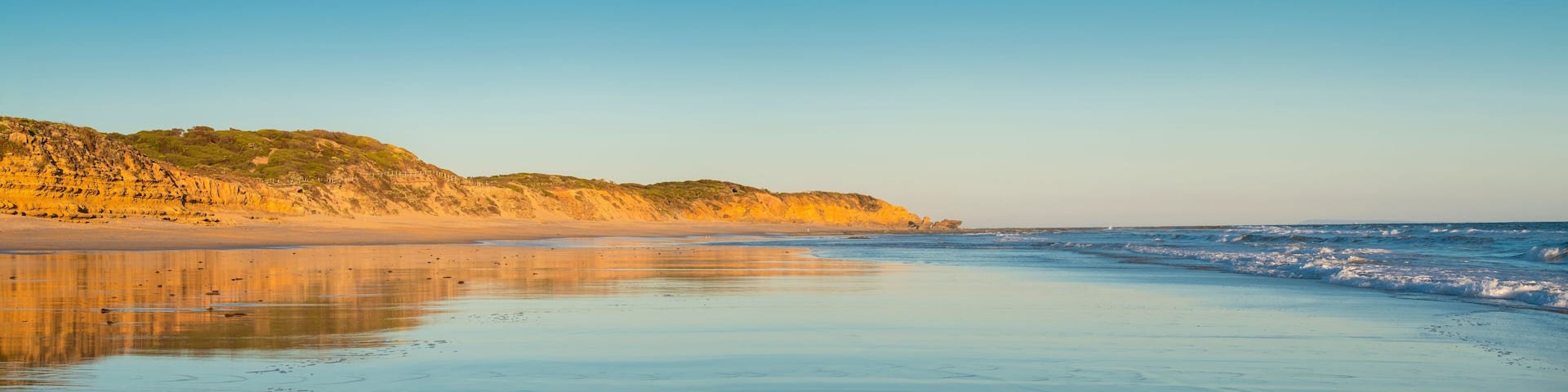 Panorama of Jan Juc beach at dusk, Jan Juc, near Torquay, Surf Coast Shire, Great Ocean Road, Victoria, Australia.