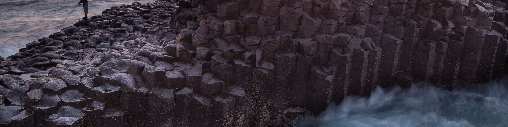 Stunning spot for sunrise. Local fisherman help show the scale of the hexagonal basalt columns that were formed from slowly cooking lava from the Mt Warning volcano.