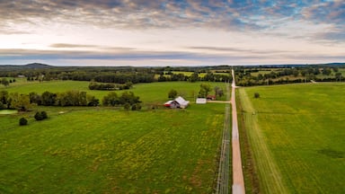 Aerial landscape of barn and homestead along a country road