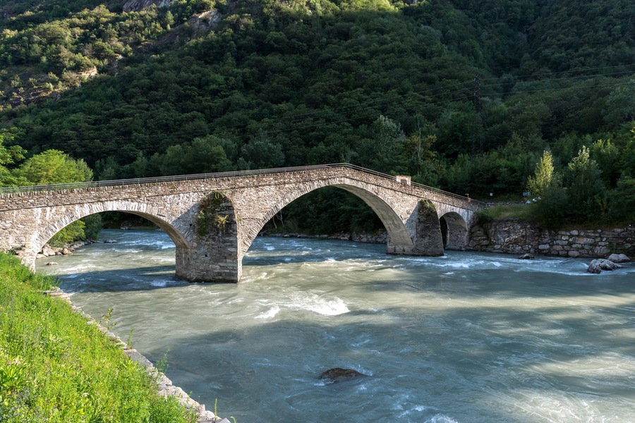 Stone bridge over the Dora Baltea River, Echallod, near Issogne, Aosta Valley (Italy)