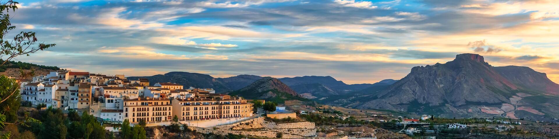 Panoramic view of a white Andalusian village on the hill at sunrise, Velez Blanco, Almeria.