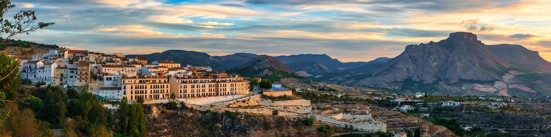 Panoramic view of a white Andalusian village on the hill at sunrise, Velez Blanco, Almeria.