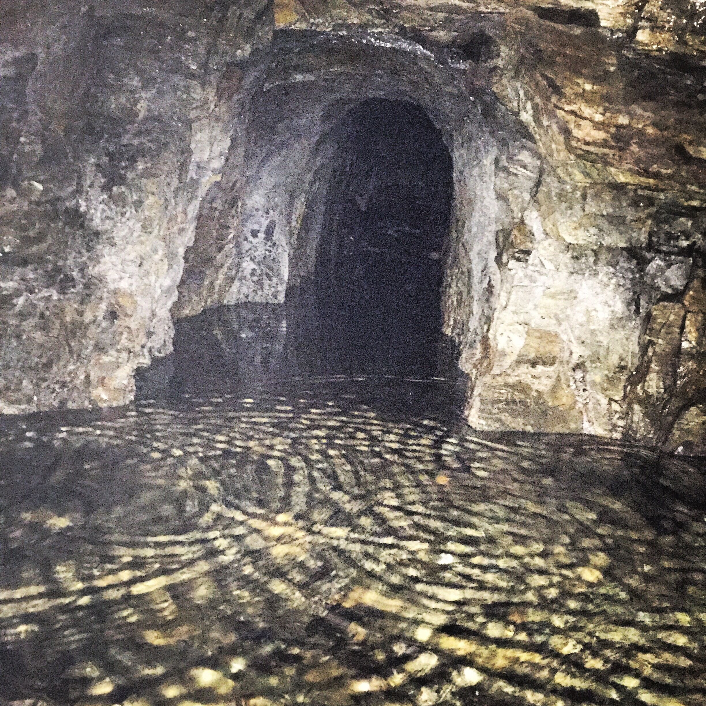 Abandoned mine adit, but with about a foot of water to hamper any exploring