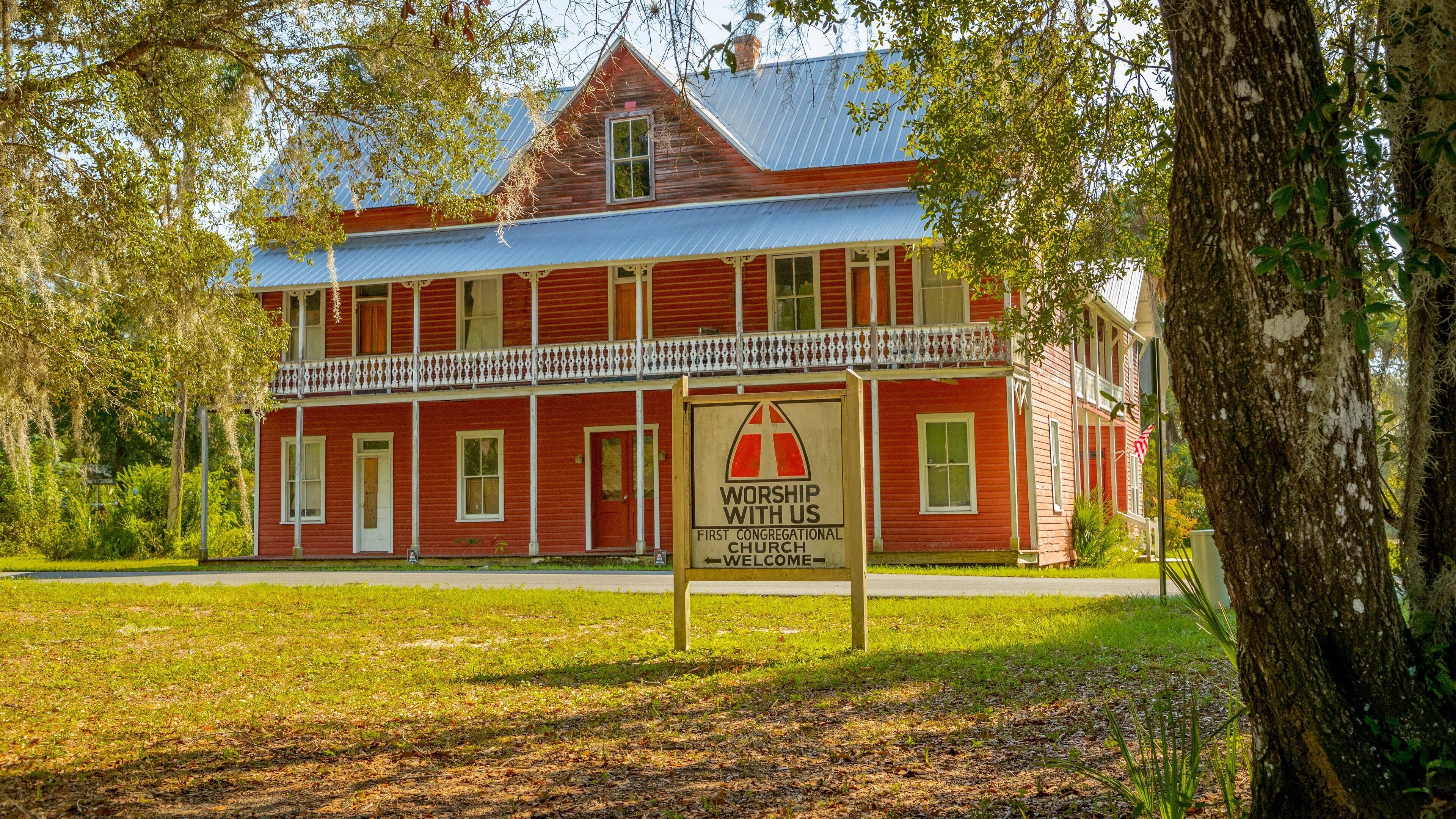 Interlachen featuring signage and a church or cathedral