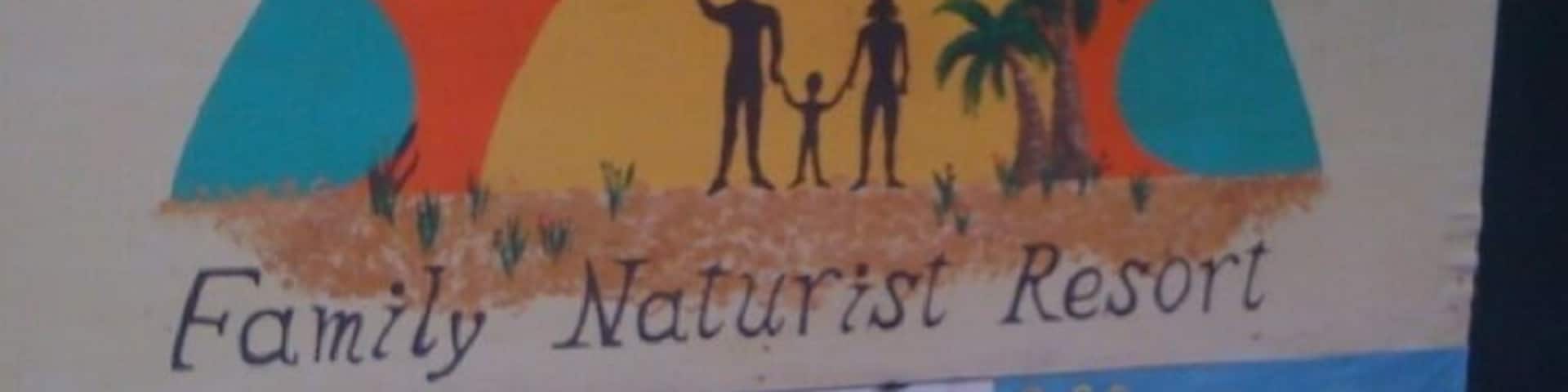 Yup, it's a nudist colony. And if you're expecting young, attractive women with perky breasts... You'd be dead wrong. Nothin' but old man saggy balls there.