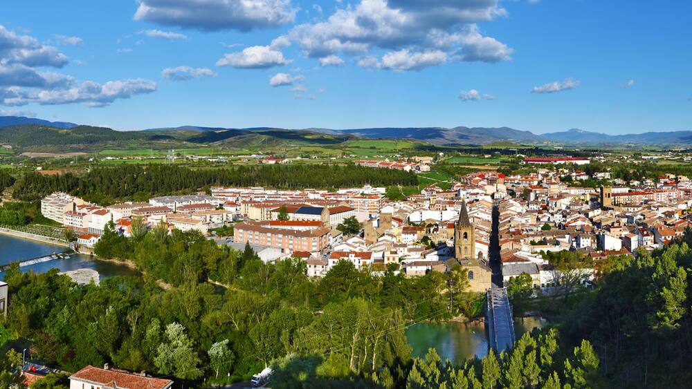 Panorama of Sanguesa city in Spanish Navarre. Aragon river and the city entrance via the bridge are at foreground