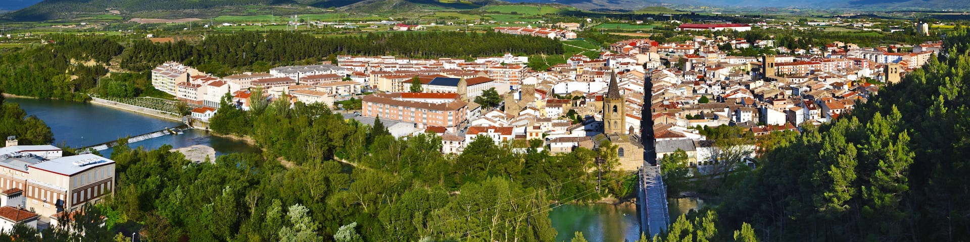 Panorama of Sanguesa city in Spanish Navarre. Aragon river and the city entrance via the bridge are at foreground