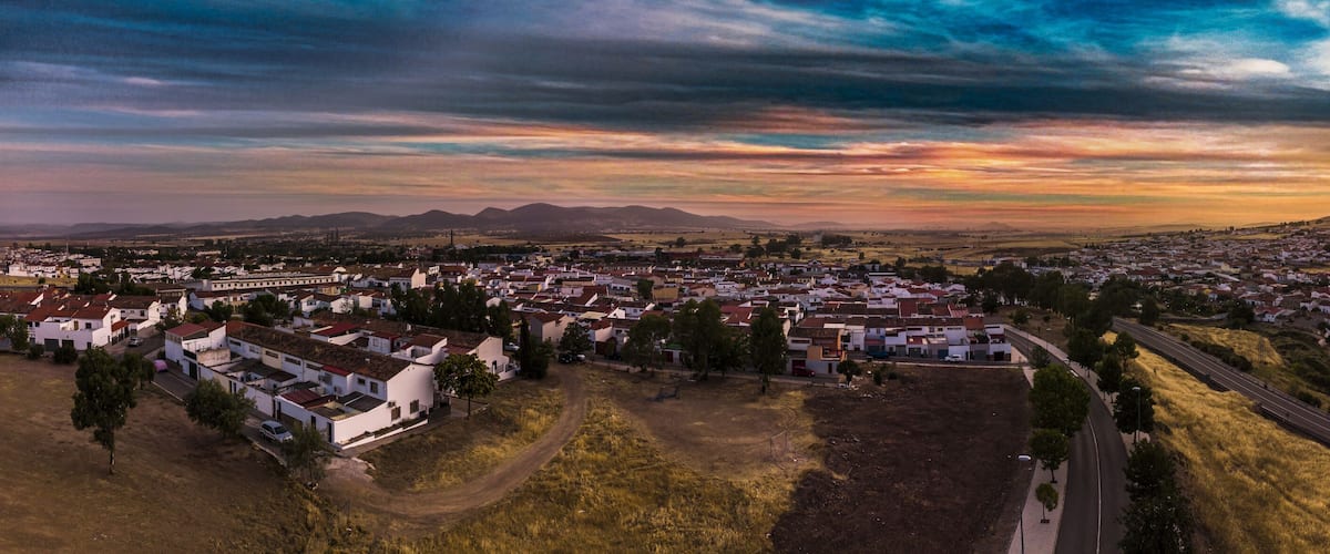A town with a prominent hill and a winding road.