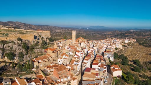 Aerial view of Cervera de Maestre castle with ruined excavated inner building remains surrounded by a partially restored outer wall of Arab origin