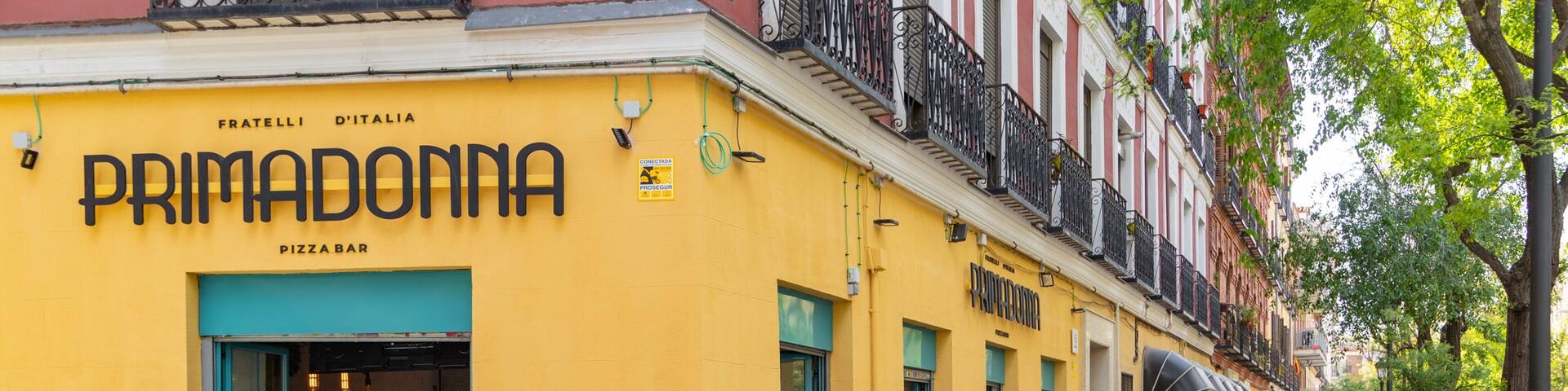 Lavapies which includes street scenes and signage as well as a small group of people