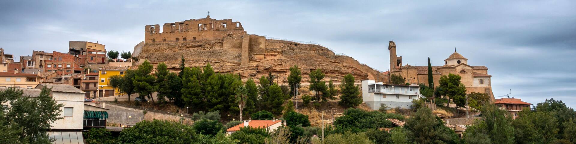 Ancient Medieval Skyline Maella Zaragoza Spain 14th Century Castle Fortress Ruins and Historic Gothic Church Townscape