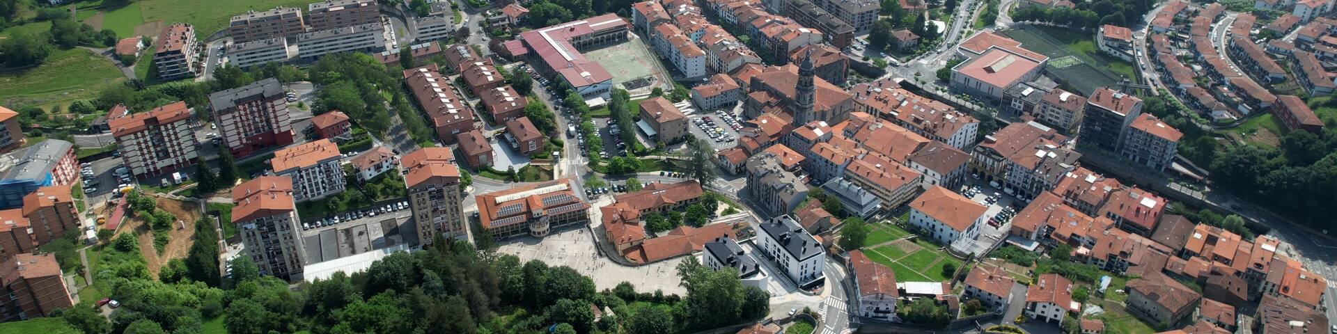 Aerial panorama view around the city Azkoitia in Spain on a sunny spring day.