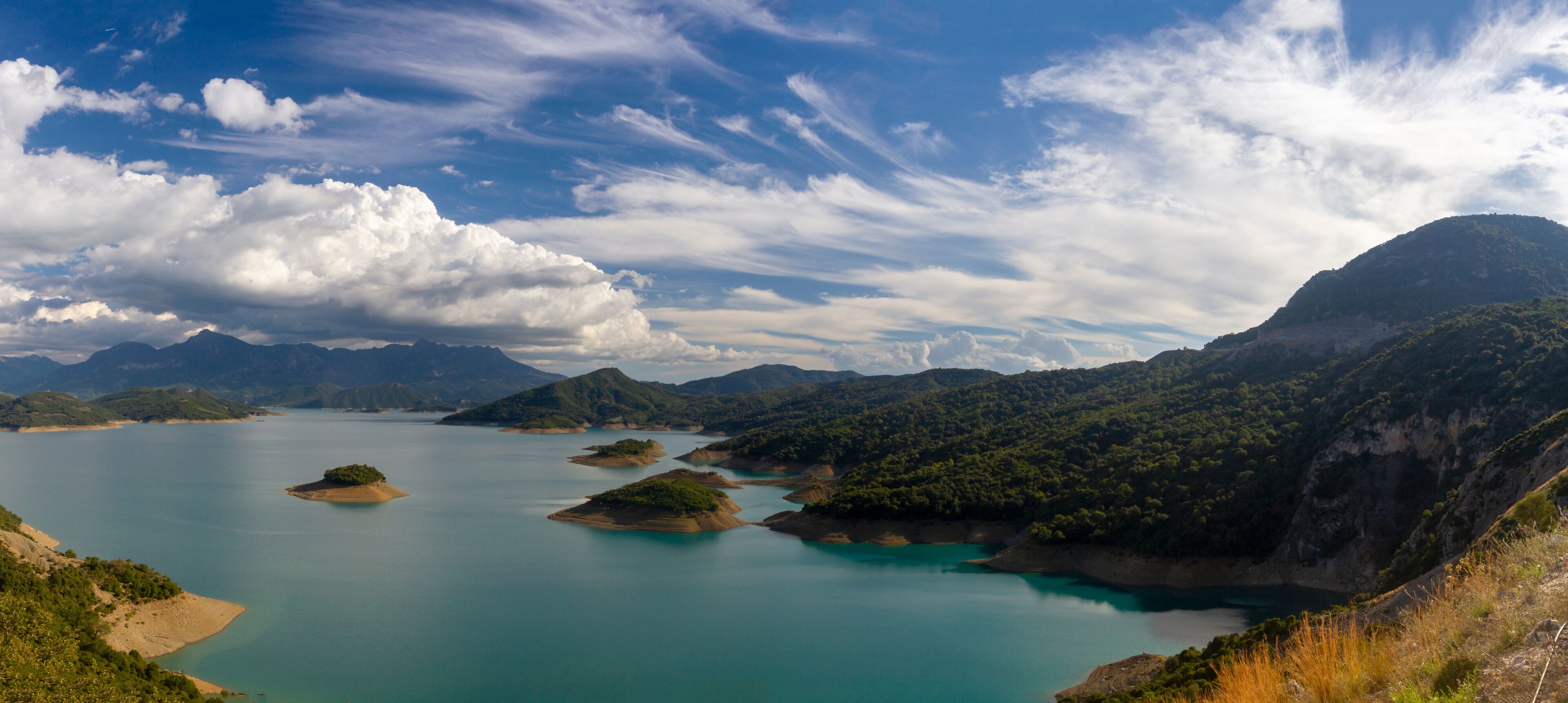 A lake surrounded by mountains and islands.