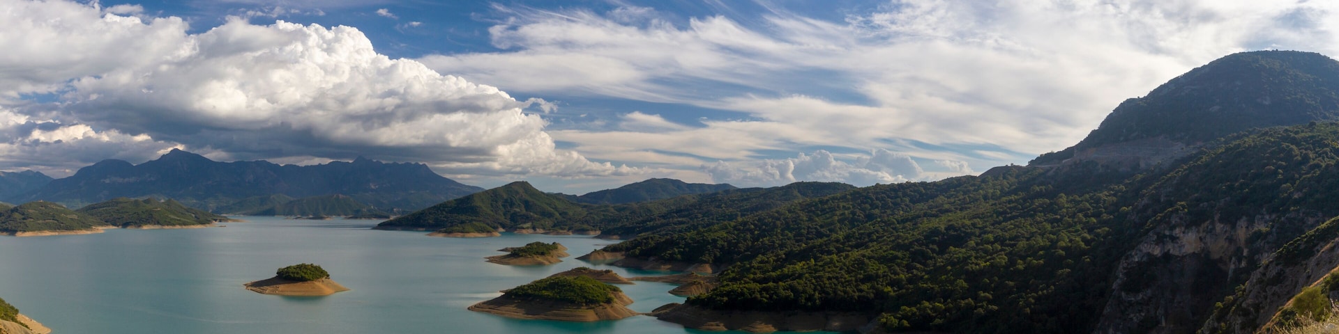 A lake surrounded by mountains and islands.