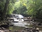 Lower falls of this three tiered beauty. You actually have to climb up the first and second falls to get to the top. Beautiful place.