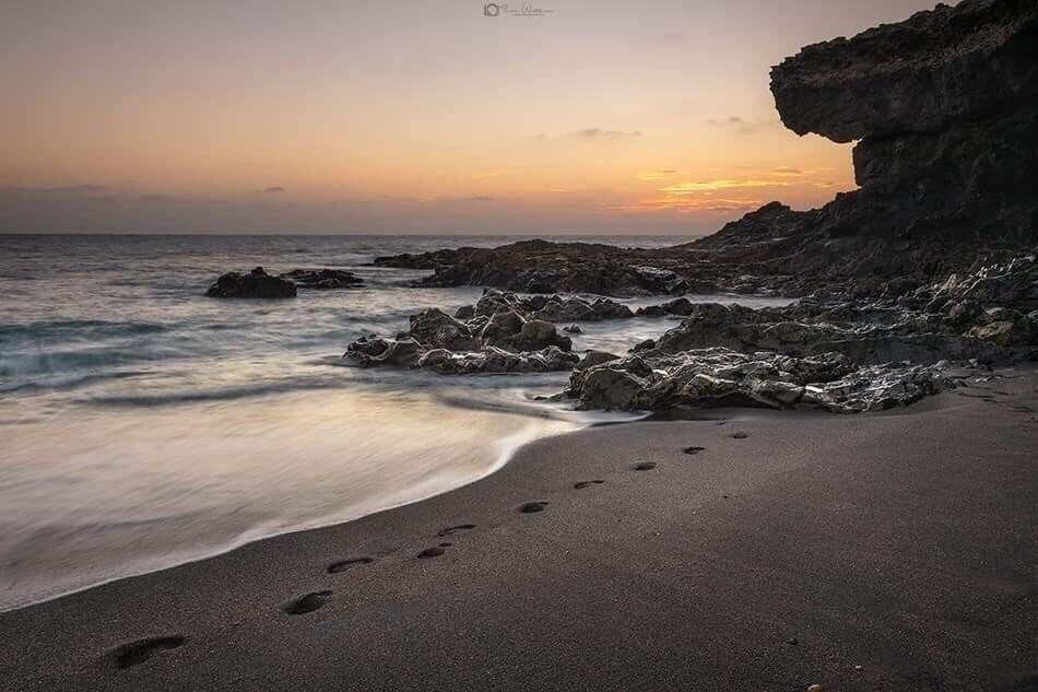 Foot prints on beach at Ajuy in fuerteventura 