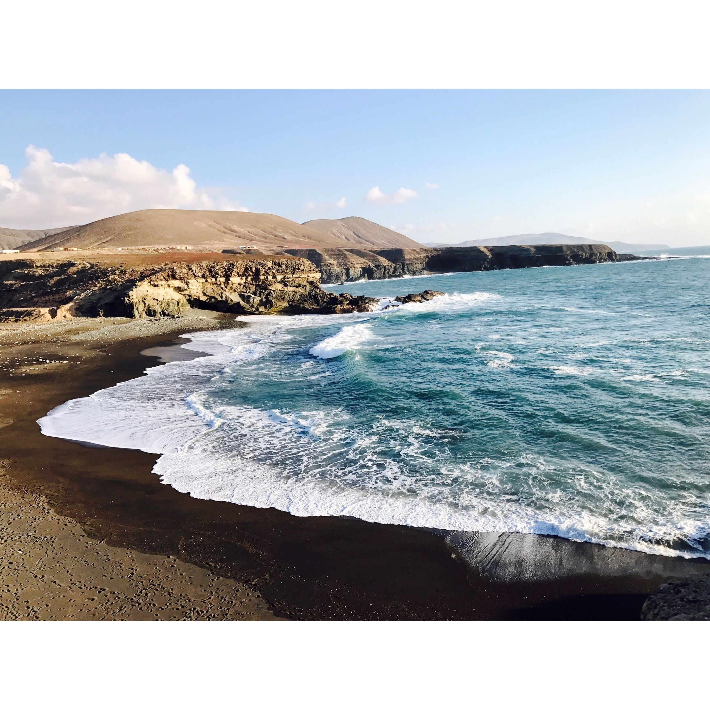 Black sand beach. A tiny town on Fuerteventura island. Not a lot people go there because you have to go through mountain road. But actually it is a very beautiful drive.