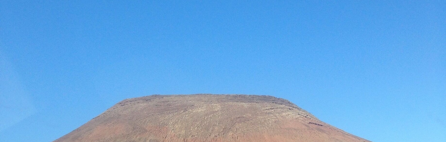 A view of the mountain from my car, on my way to corralejo seeing this inactive vulcano mountain was soothing to my soul