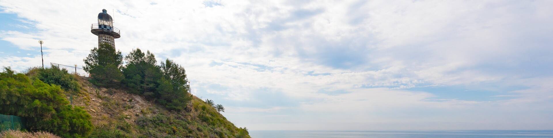 Carvajal Beach which includes general coastal views and a lighthouse