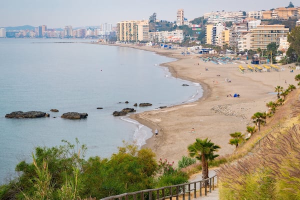 Carvajal Beach which includes general coastal views, a beach and a coastal town
