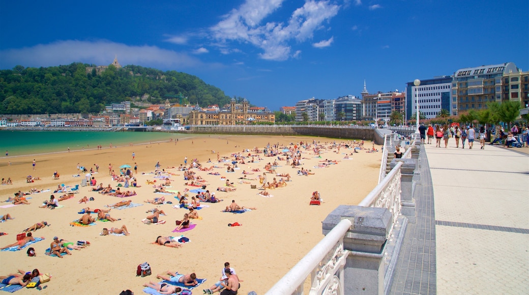Concha Promenade which includes general coastal views, a beach and a coastal town