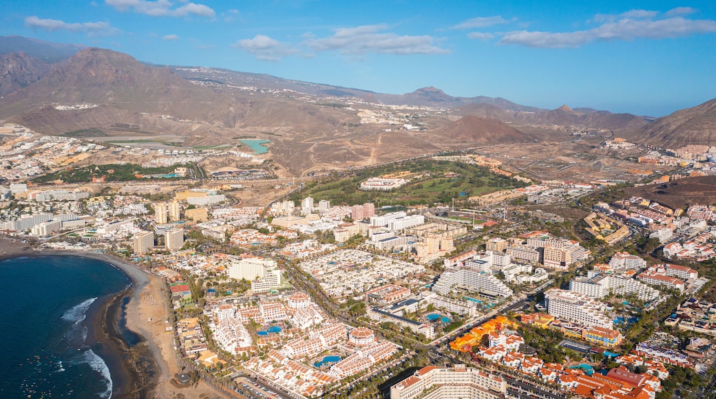 Aerial photo from drone to de Tenerife and beachs Adeje Playa de las Americas, Playa Honda,Playa de Troya, Playa de El Bobo.In the background Tenerife at sunset. Tenerife, Canary islands, Spain