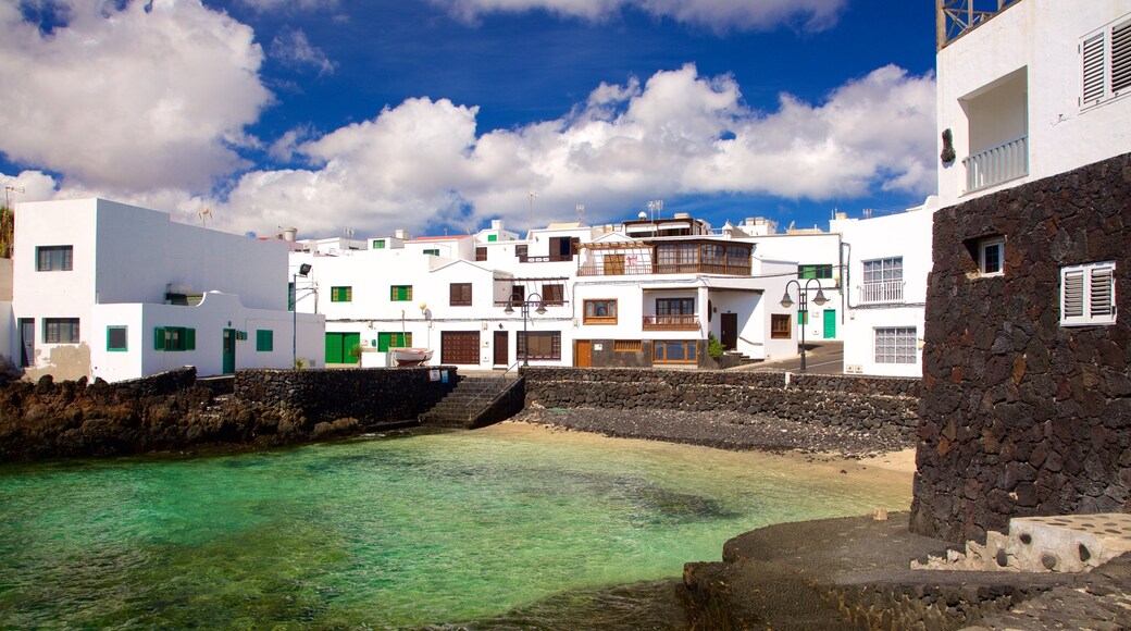 Lanzarote which includes rugged coastline, general coastal views and a coastal town