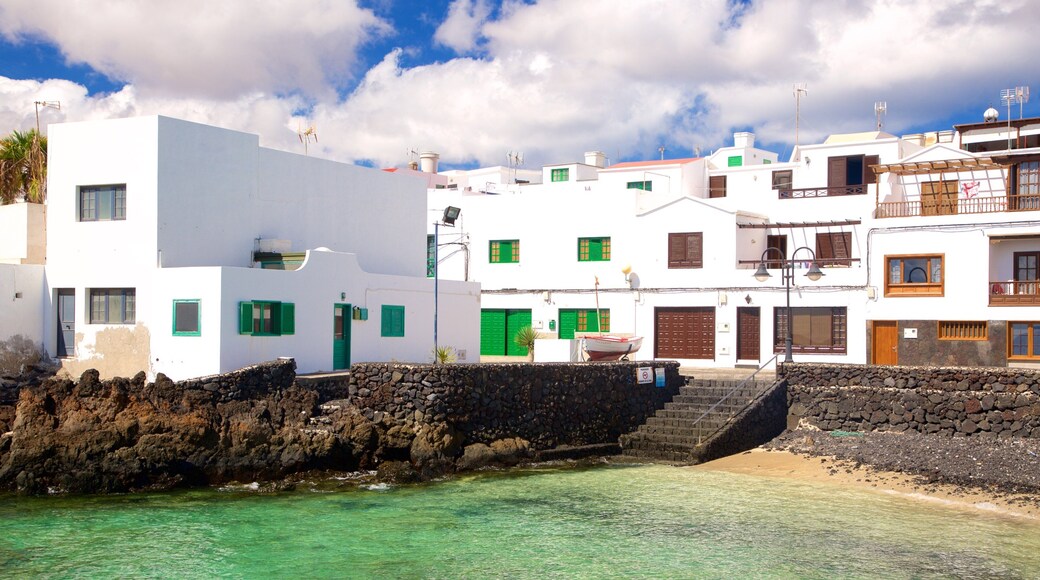Lanzarote which includes general coastal views, a coastal town and rugged coastline