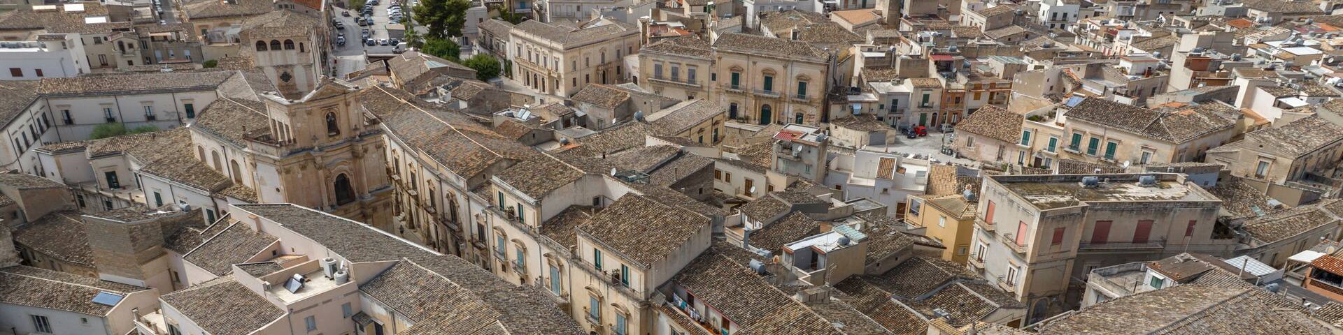 Aerial view of the historic center of Scicli, in the province of Ragusa, Sicily, Italy. The Church of San Michele Arcangelo and the Church of San Giovanni are also nearby.
