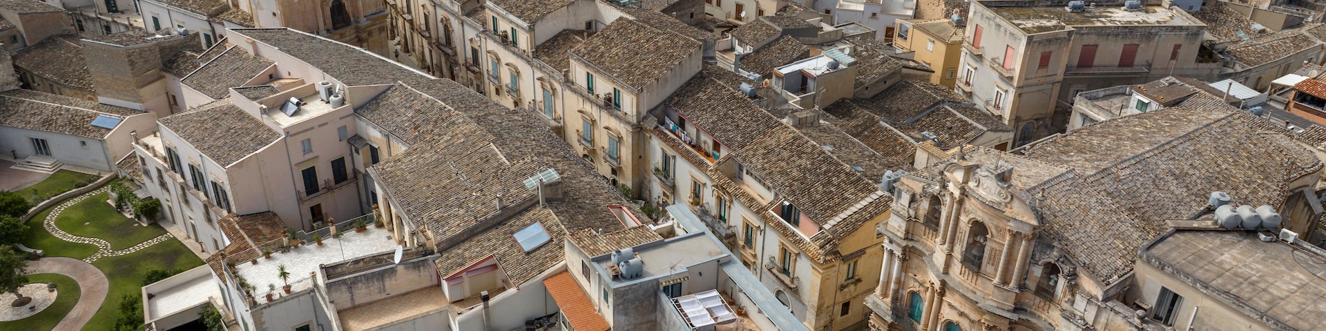 Aerial view of the historic center of Scicli, in the province of Ragusa, Sicily, Italy. The Church of San Michele Arcangelo and the Church of San Giovanni are also nearby.