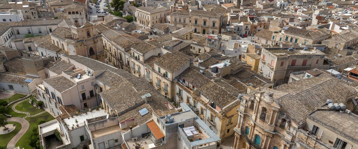 A densely packed urban area with historic buildings, narrow streets, and a mix of architectural styles.