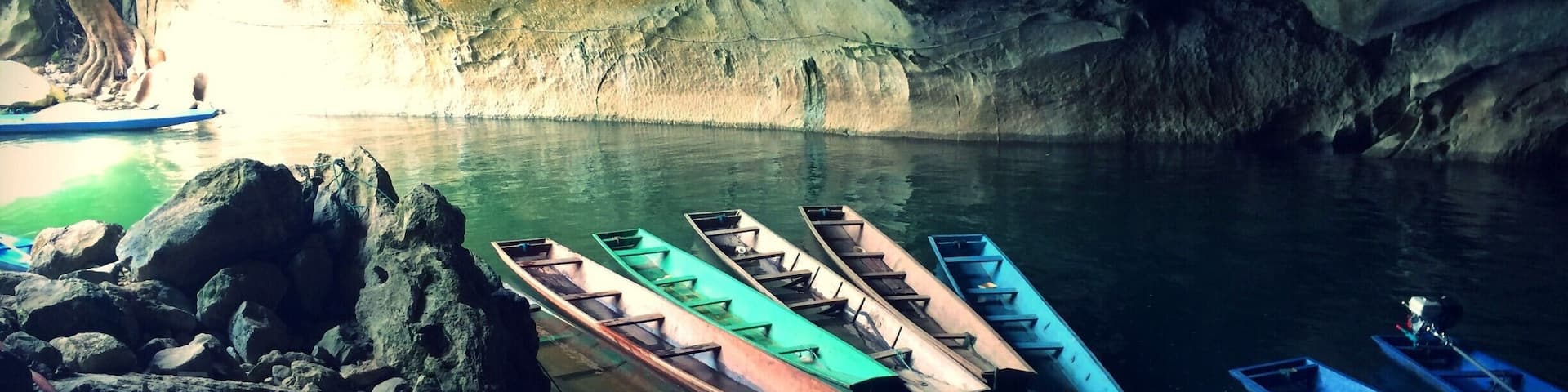 An unexpected destination during my trip to Laos. I ended up visiting Kong Lor Cave, located in the small village of Kong Lor, in central Laos. We entered the pitch black cave on a very basic long boat and a torch on our heads. You exit on the other side of the cave to a beautiful, lush green scenery where buffalos rest in the water, butterflies fill the air, and there's a perfect quietness.