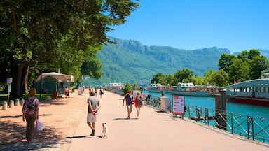 Lake Annecy which includes a garden, a marina and a river or creek