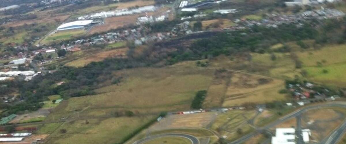 An aerial view of a complex highway interchange with multiple ramps and junctions.