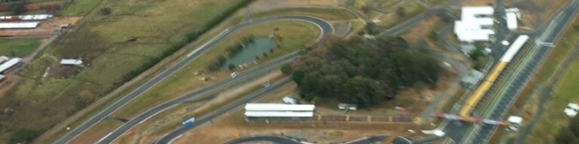 An aerial view of a complex highway interchange with multiple ramps and junctions.