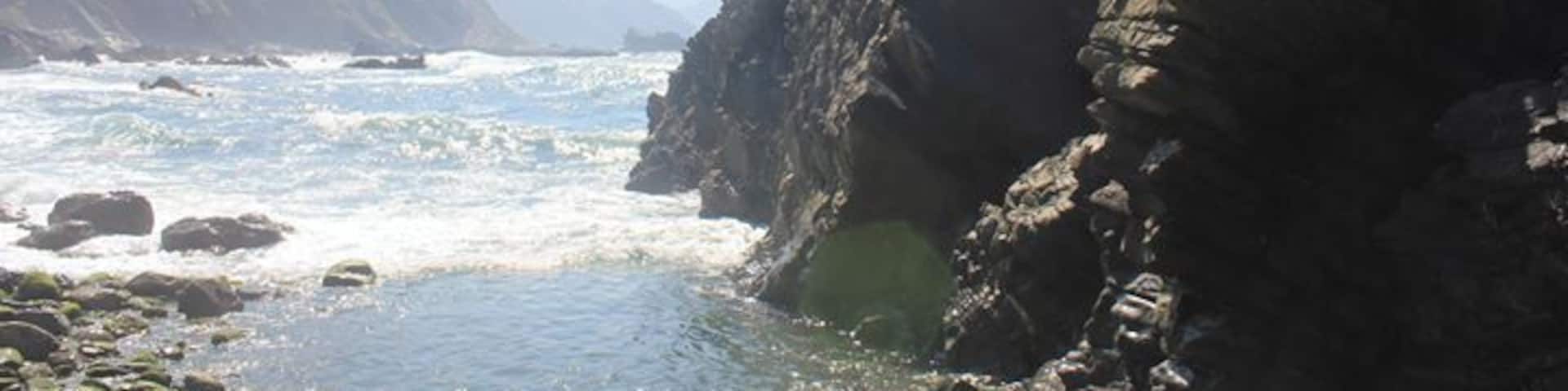 Walking over hard rocks, passing the tourists, you find this beautiful part of Asturias. It's hidden at the end of a rough path, but definitely worth it. Enjoy the view and sound of the waves crashing by climbing on a rock. It's very peaceful.