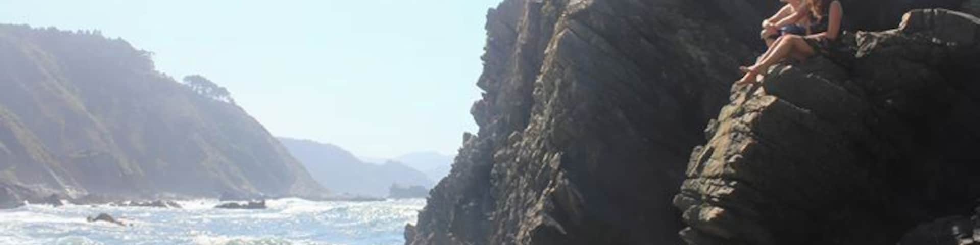 Walking over hard rocks, passing the tourists, you find this beautiful part of Asturias. It's hidden at the end of a rough path, but definitely worth it. Enjoy the view and sound of the waves crashing by climbing on a rock. It's very peaceful.