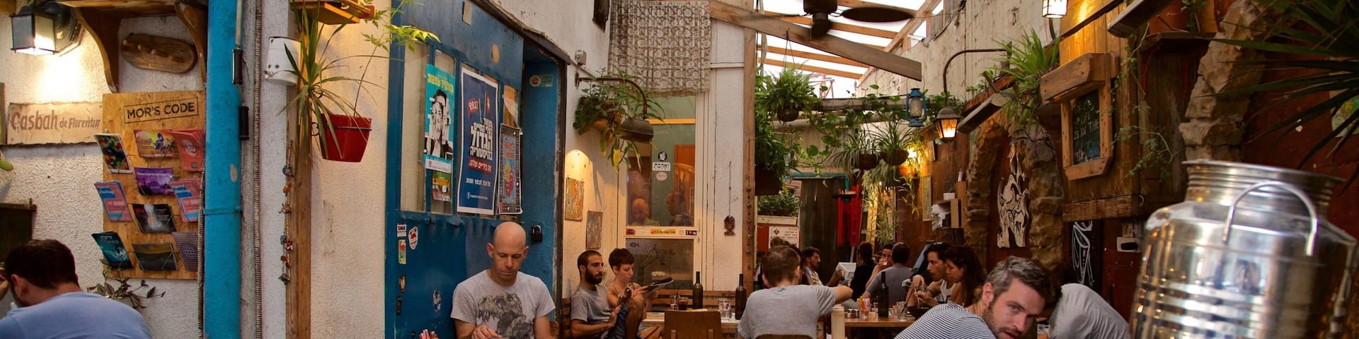Florentin which includes outdoor eating as well as a large group of people