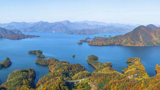 High angle and autumnal view of early maple at Crocodile Island of Chungjuho Lake at Salmi-myeon near Chungju-si, South Korea