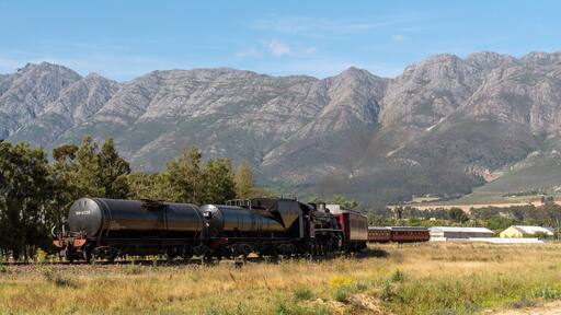 Wolseley, Swartland region, South Africa. Dec 2019. Steam train, diesel powered crossing a rural landscape at Wolseley. In the Swartland region of South Africa.
