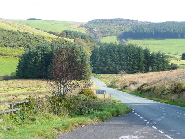 Mountain road to Llandiloes Looking east from the Dylife Gorge viewpoint towards the distant forested slopes of Pen-cerrigyffynnon. This is the scenic route over the Cambrian watershed from Machynlleth.