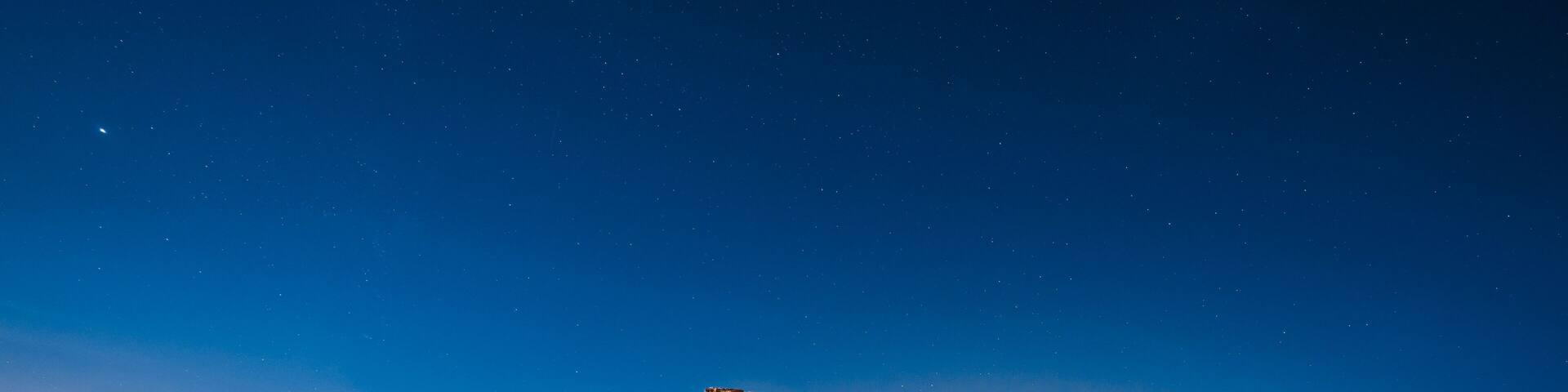 Starry night landscape in a ruined castle. Castillo de Castro, Spain.
