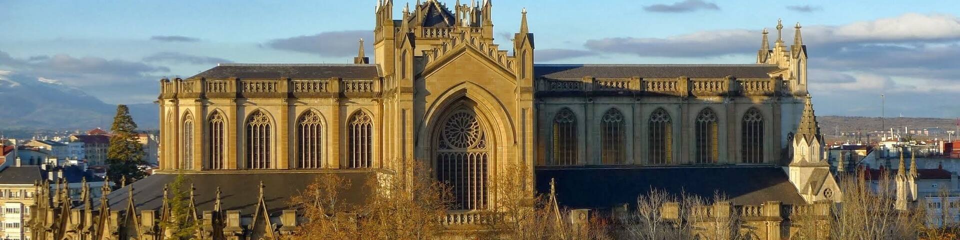 A large Gothic-style cathedral with intricate architecture and a prominent rose window.