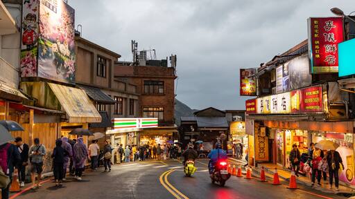 Jiufen which includes night scenes, a small town or village and street scenes
