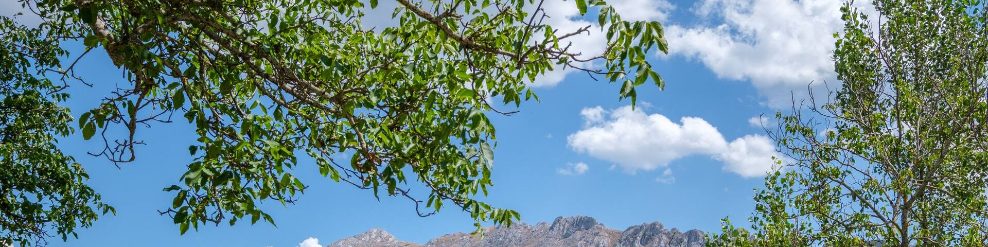 Lois Church Cathedral Mountain, Cremenes Leon, Spain. Veined Red Marble Limestone Facade